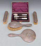 George V four piece hallmarked silver mounted dressing table set including hand mirror,
