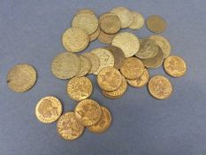 A collection of Victorian gaming counters in the form of spade guineas and Hanover tokens