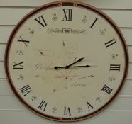 A caseless quartz dial wall clock, the Roman dial decorated with postmark and address,