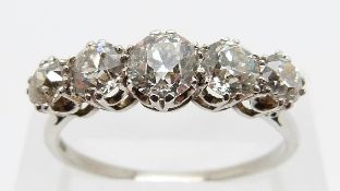 A platinum ring set with five old cut diamonds, the centre diamond measuring approximately 0.