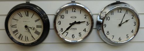 Three Jones quartz dial wall clocks, two with Arabic numerals, one with Roman numerals,