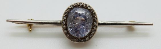 A Victorian brooch set with a pale blue cushion cut sapphire (approx 6.
