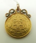 An 1898 South African 1 Pond gold coin with mount, 9.