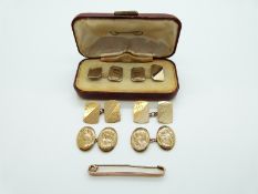 Two pairs of 9ct gold cufflinks, one with engraved foliate design and one engine turned design,