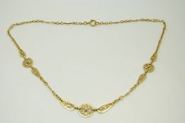 A 9ct gold filigree necklace, 9.