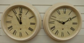 Two Newgate quartz dial wall clocks, both with Roman numerals,