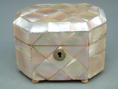 A 19thC mother of pearl tea caddy raised on ball feet, H 8.5cm, L 14.