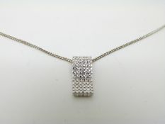 An 18ct white gold chain and a pendant set with diamonds in a rectangular setting, 3.