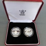 A cased pair of silver piedfort two pound coins, tercentenary and United Nations 1994 and 1995,
