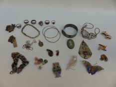 A collection of silver jewellery including Arts & Crafts hammered white metal pendant,