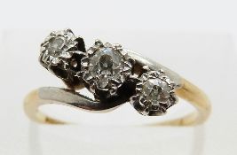 An 18ct gold ring set with three diamonds in a platinum twist setting, size L, 2.