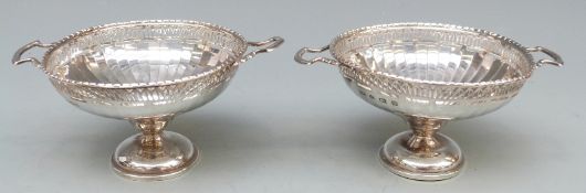 A pair of George V Mappin & Webb hallmarked silver twin handled pedestal bon bon dishes with