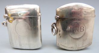 Two early 20th century hallmarked silver vestas, both with engraved Art Deco designs,