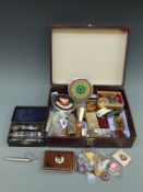 A quantity of collectable items including car badges, penknives, cigarette lighters, lapel badges,
