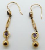 A pair of Edwardian 9ct gold earrings each set with two amethysts
