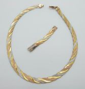 A tri-coloured necklace marked 9k, 14.