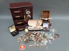 A collection of costume jewellery earrings, brooches,