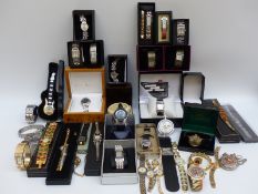 A large collection of various ladies and gentleman's wristwatches.