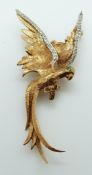 A 9ct gold brooch in the form of a parrot set with a green paste eye,
