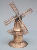 Continental white metal novelty windmill with rotating sails and hand wheel, height 10cm,