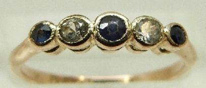 A 9ct gold ring set with alternating sapphires and diamonds, size N, 1.7g.