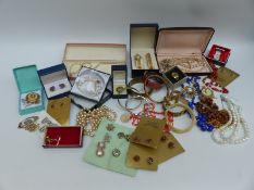 A collection of costume jewellery including faux pearls, bangles, glass beaded necklace,