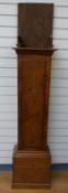 A pine 19thC longcase clock case with pendulum