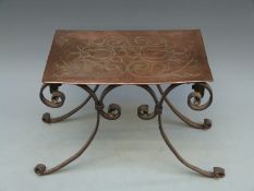 An Arts and Crafts wrought iron and copper trivet, possibly Birmingham Guild of Handicrafts,