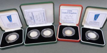 A collection of cased UK silver proof fifty pence coins comprising five coins in four cases with