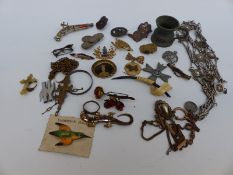 A quantity of costume jewellery including a Miracle brooch in the form of a gun, dog brooch,