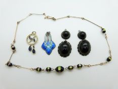 A 9ct gold pendant set with blue paste, 1.