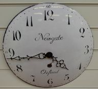 A caseless quartz dial wall clock with Arabic numerals and 'Newgate Oxford' to white enamelled