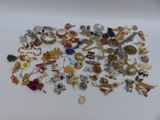 A collection of brooches including Miracle, thistle, pheasant and Mizpah, Art Deco necklace, L.