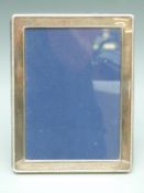 Modern hallmarked silver photograph frame to suit 7 x 5 inch photograph, with enamel back,