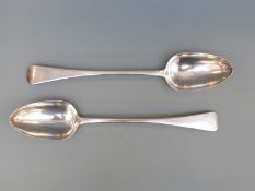 A pair of Georgian hallmarked silver basting spoons London 1828, maker's mark James Beebe,