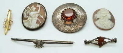 A silver brooch set with a cameo, a loose cameo, a clip,