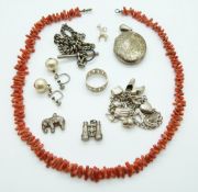 Victorian white metal locket with engraved swallow and foliate decoration, coral necklace,