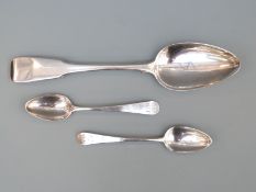 Three hallmarked silver spoons including a Georgian Scottish fiddle pattern tablespoon,