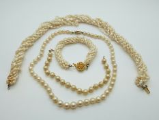 A pearl necklace with a 9ct gold clasp together with a multi strand pearl necklace and matching