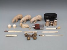 Four brass ball and claw feet, bone stanhope, Victorian ivory finials, carved polar bears,