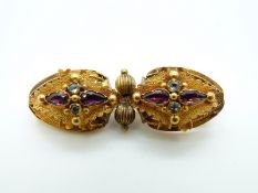 An early Etruscan Revival Victorian yellow metal brooch with textured leaf decoration set with
