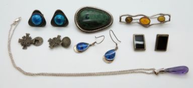 A collection of silver including brooch, earrings, cufflinks and necklace,