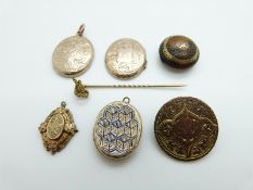 A tortoiseshell button inlaid with gold plate,