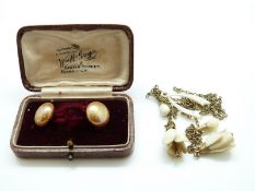 A pair of 9ct gold earrings each set with a faux pearl,