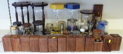 A large collection of sand timers, some cased,