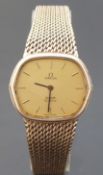 Omega DeVille 9ct gold ladies wristwatch with gold face, black hands,