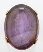 A 9ct gold ring set with a large oval cut amethyst, size L, 8.