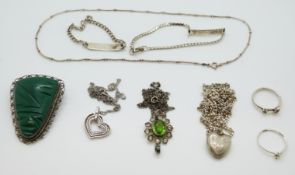 Two silver rings, a silver brooch, identity bracelets,