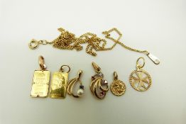 A 9ct gold pendant set with a diamond and rubies, a 9ct gold pendant set with a pearl and sapphire,