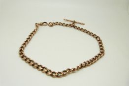 A 9ct rose gold curb link Albert, 37.
